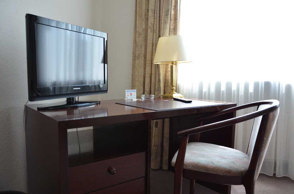 A desk and TV in one of our rooms