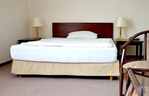 Bed in one of our rooms